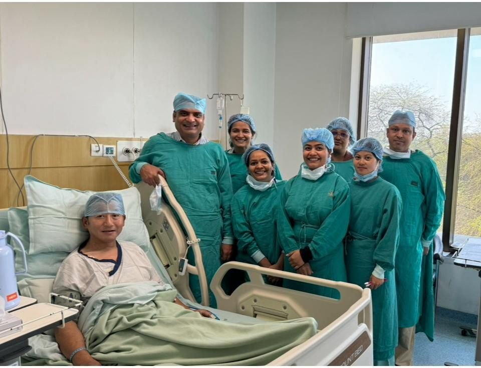 Dr Manoj Gupta with the transplant team and a patient in the liver ICU